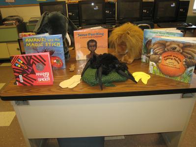 The African folktale books and puppets from Sully's mother.