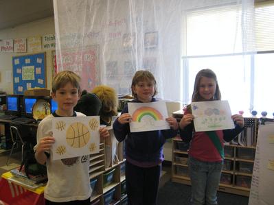 Alex, Audra, and Grace with pictures for our new friends.