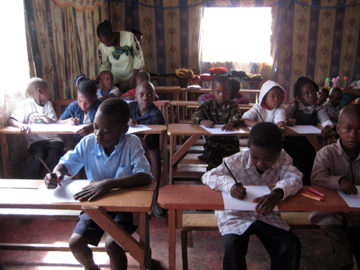 Students in Zambia coloring us pictures.