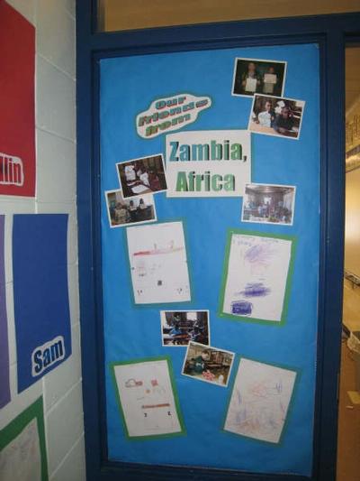 The bulletin board outside our classroom that displays the artwork from our friends.