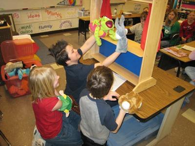 Sam, Alexis, and Alex entertained with their version of The Three Little Pigs